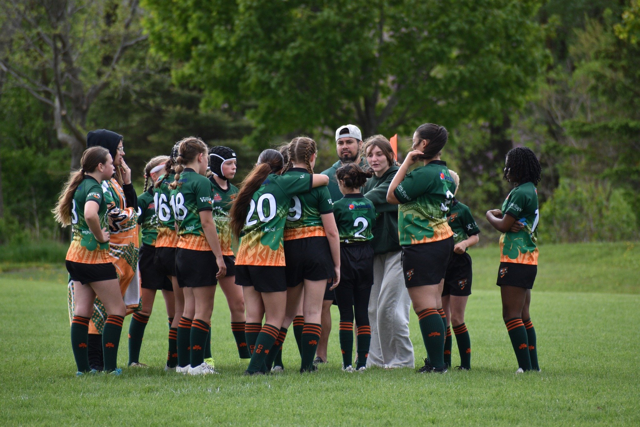 Youth athletes building teamwork through rugby